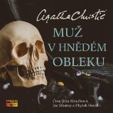 Muž v hnědém obleku